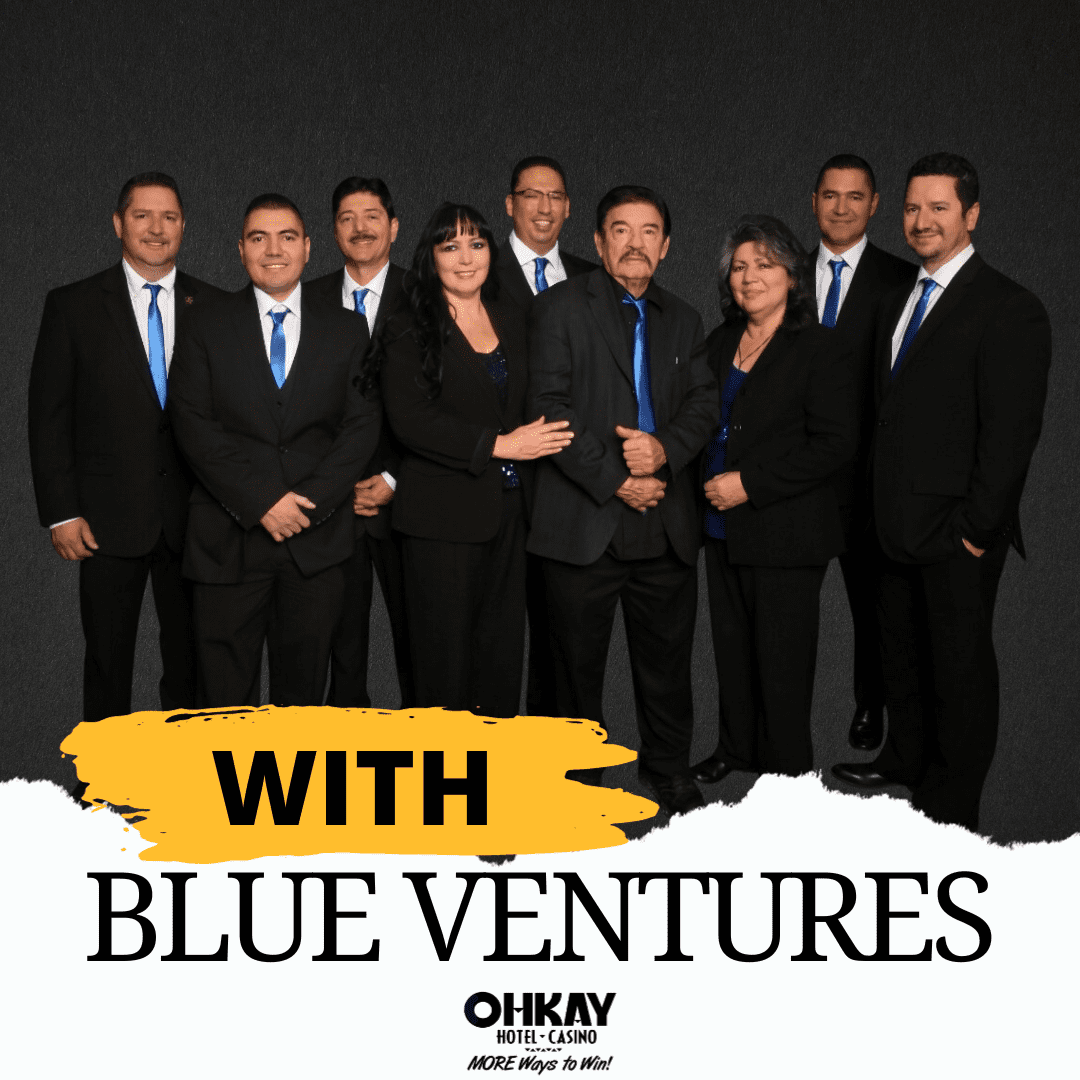 A group of people posing for a photo with blue ventures.