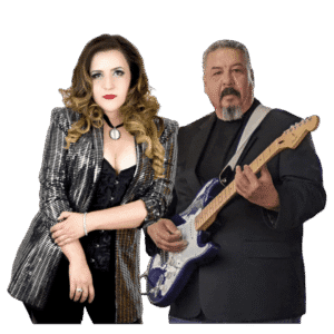 A man and woman standing next to each other holding guitars.