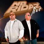 Two men posing with sunglasses, "NB Ridaz" logo.